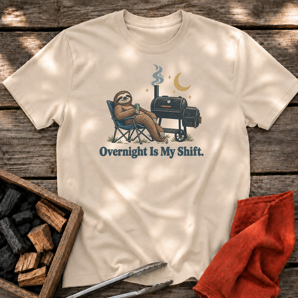 Sand T-shirt with the design “Overnight Is My Shift.” printed on the front.