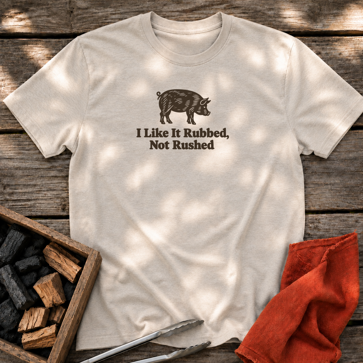 Natural T-shirt with the design “I Like It Rubbed, Not Rushed” printed on the front.