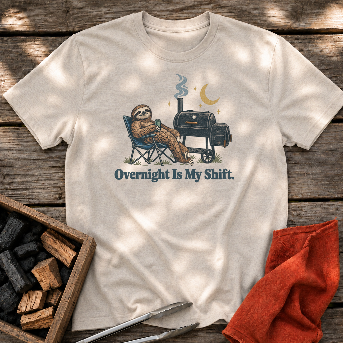 Natural T-shirt with the design “Overnight Is My Shift.” printed on the front.