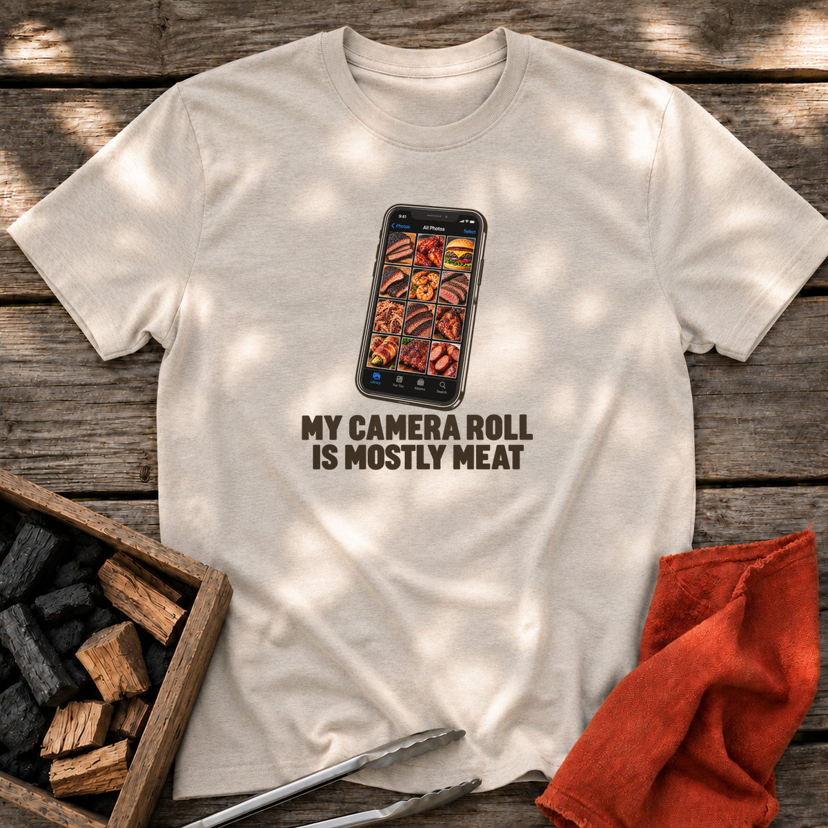 Natural T-shirt with the design “MY CAMERA ROLL IS MOSTLY MEAT” printed on the front.