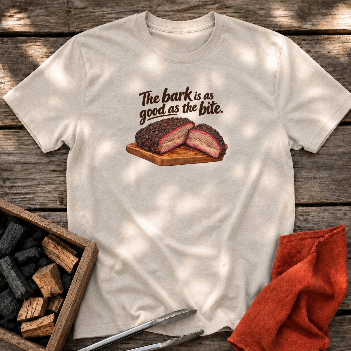 Natural T-shirt with the design “The bark is as good as the bite.” printed on the front.
