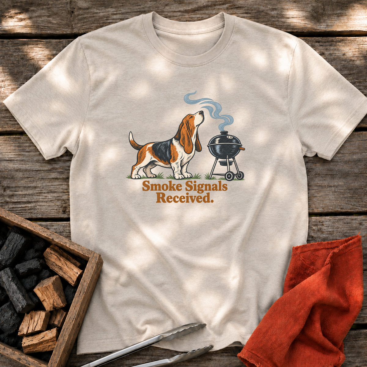 Natural T-shirt with the design “Smoke Signals Received.” printed on the front.