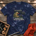 Navy T-shirt with the design “Patience Is My Secret Ingredient.” printed on the front.