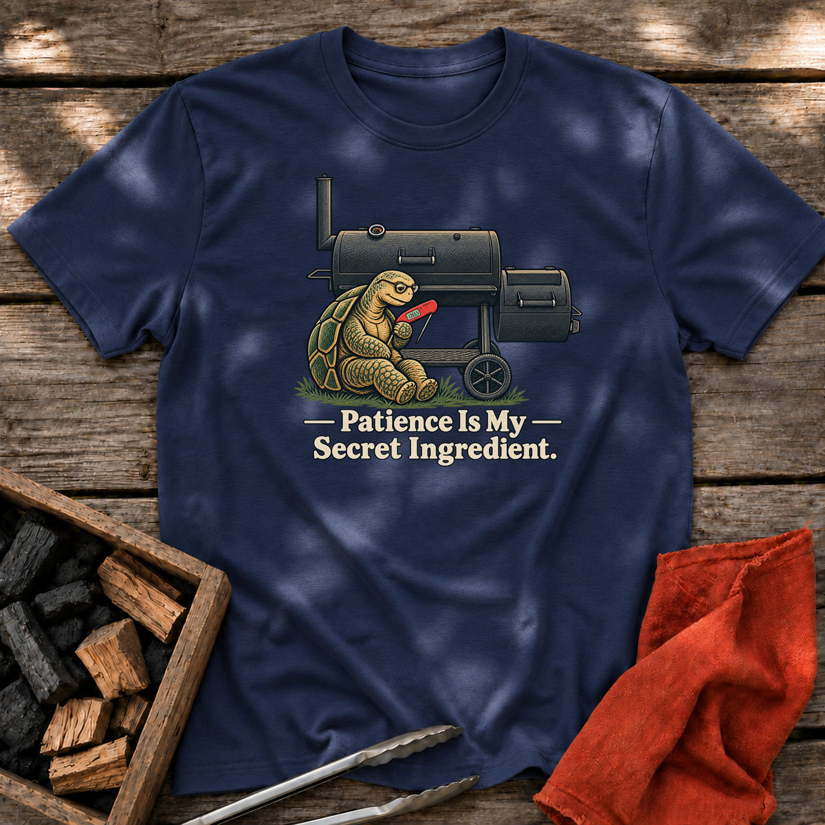 Navy T-shirt with the design “Patience Is My Secret Ingredient.” printed on the front.