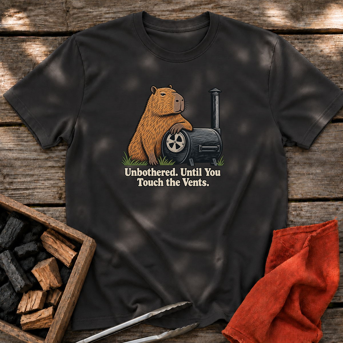 Black T-shirt with the design “Unbothered. Until You Touch the Vents.” printed on the front.