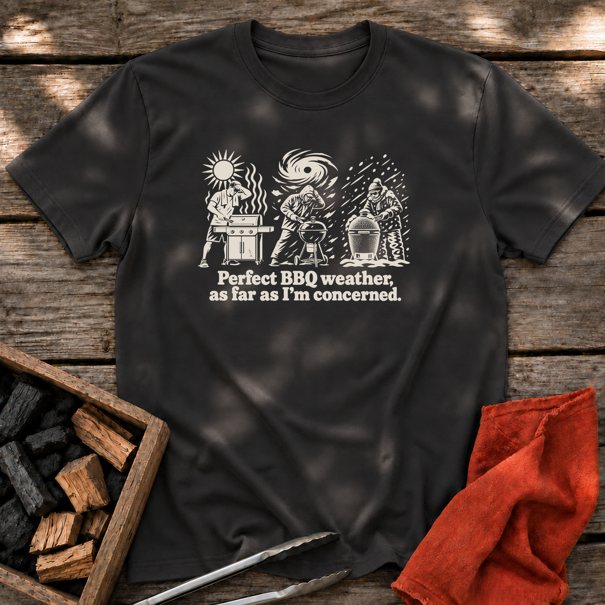 Black T-shirt with the design “Perfect BBQ weather, as far as I'm concerned.” printed on the front.
