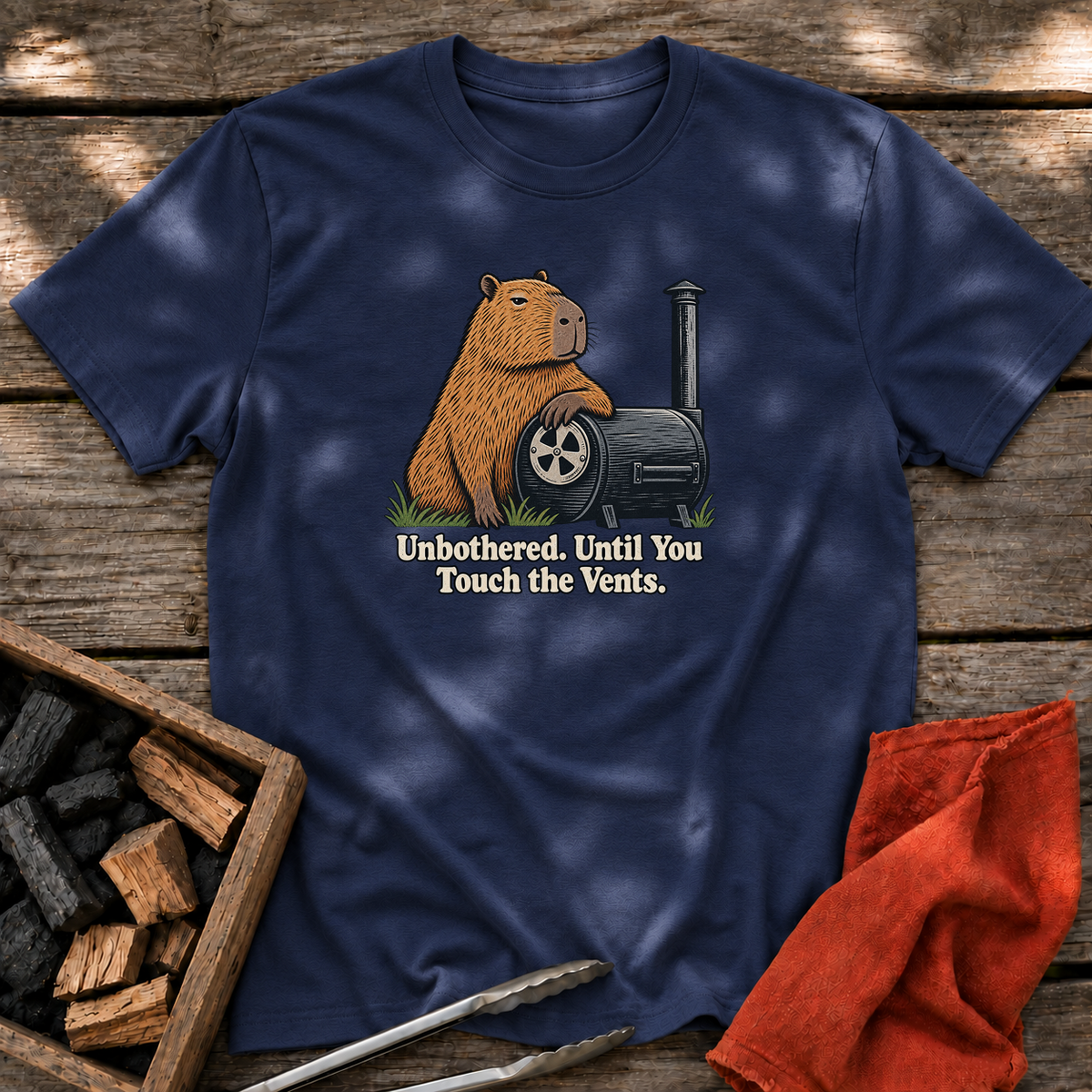 Navy T-shirt with the design “Unbothered. Until You Touch the Vents.” printed on the front.