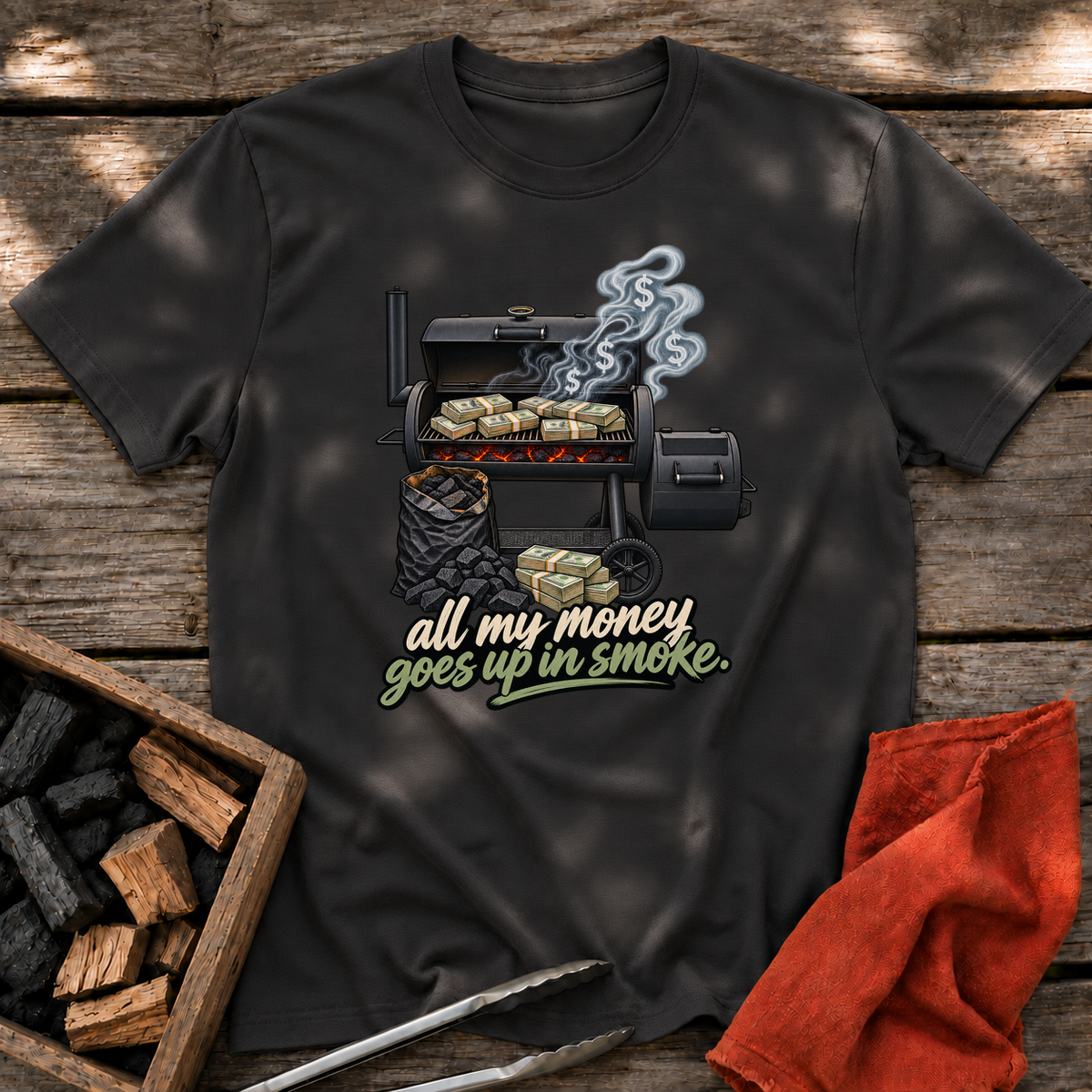 Black T-shirt with the design “all my money goes up in smoke.” printed on the front.
