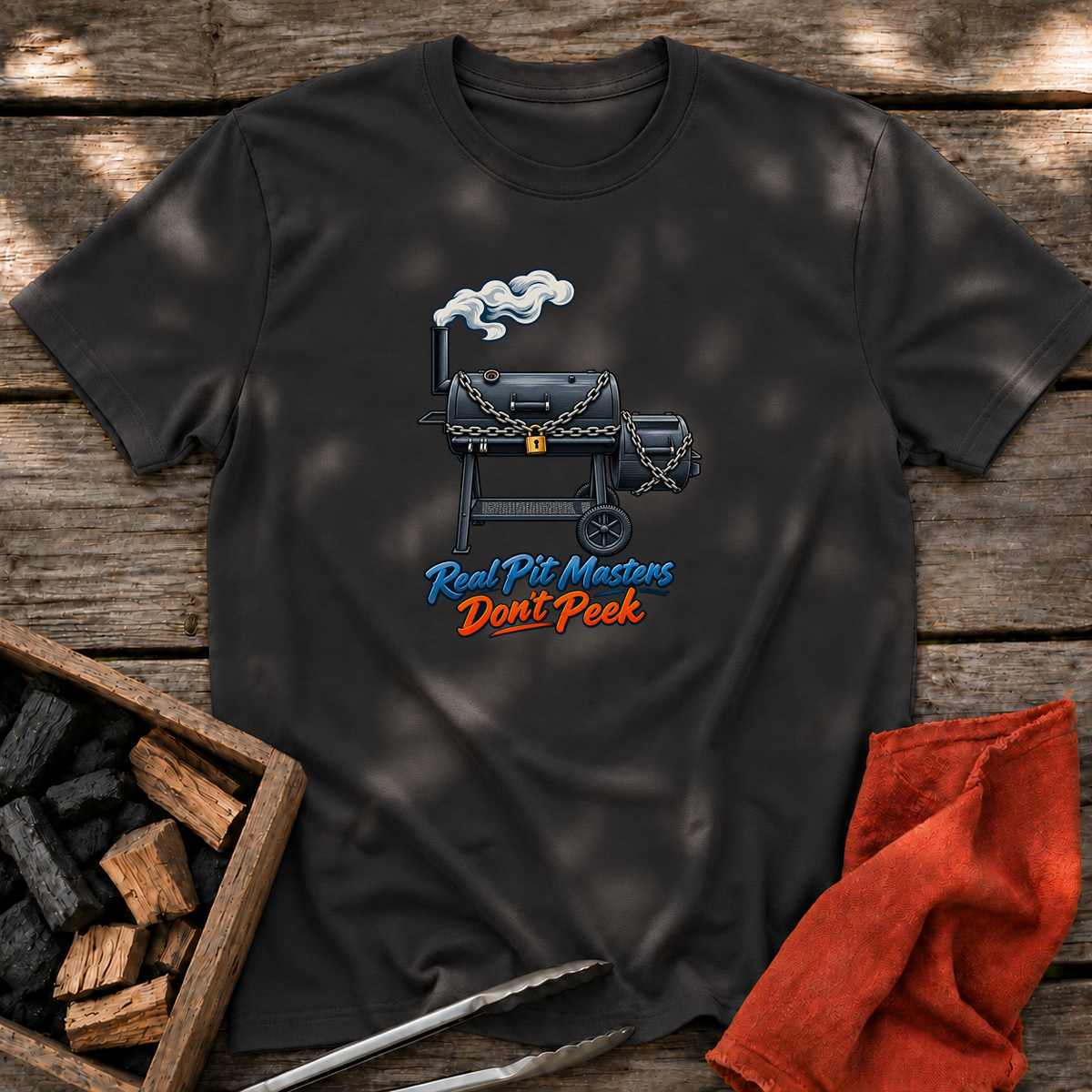 Black T-shirt with the design “Real Pit Masters Don't Peek” printed on the front.