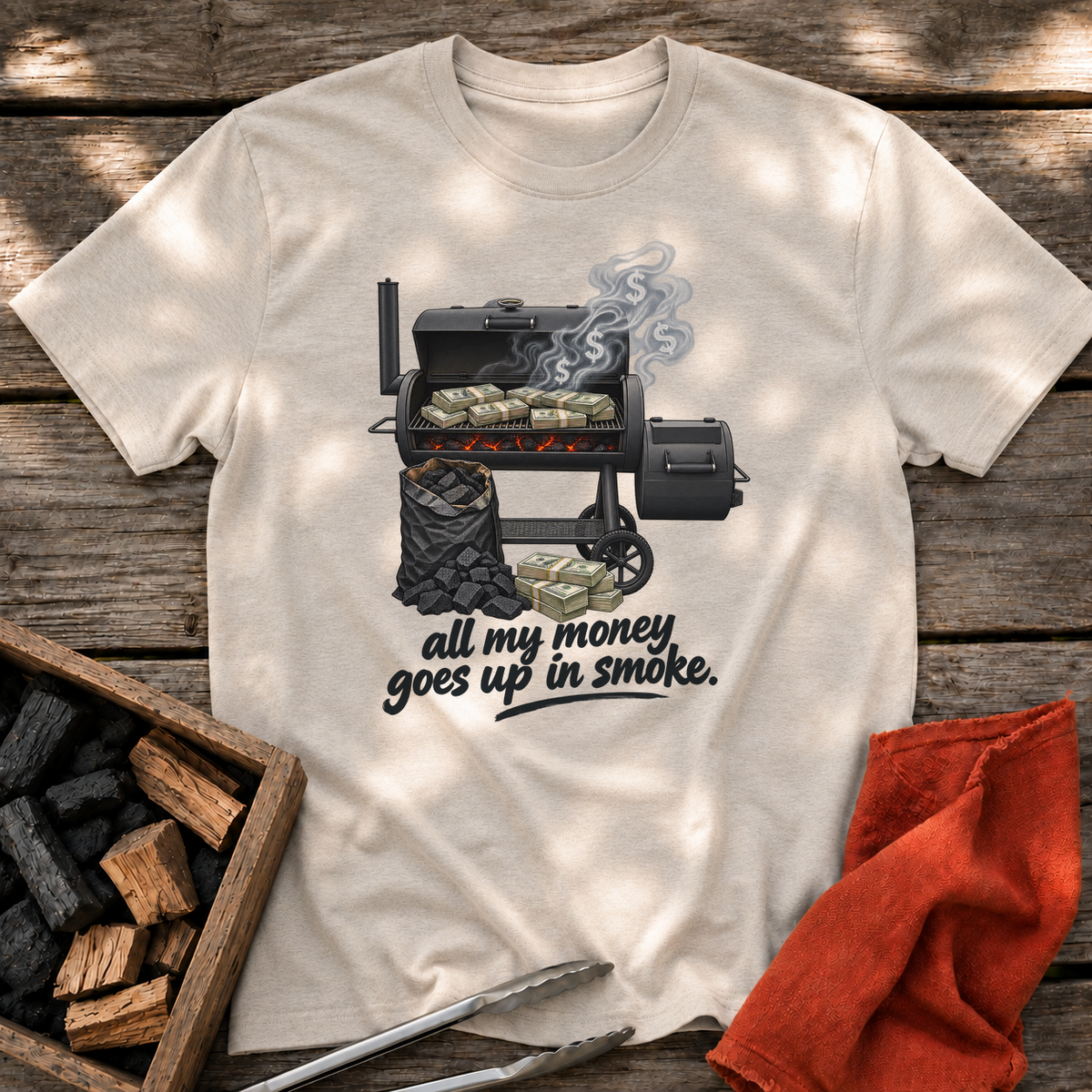 Natural T-shirt with the design “all my money goes up in smoke.” printed on the front.