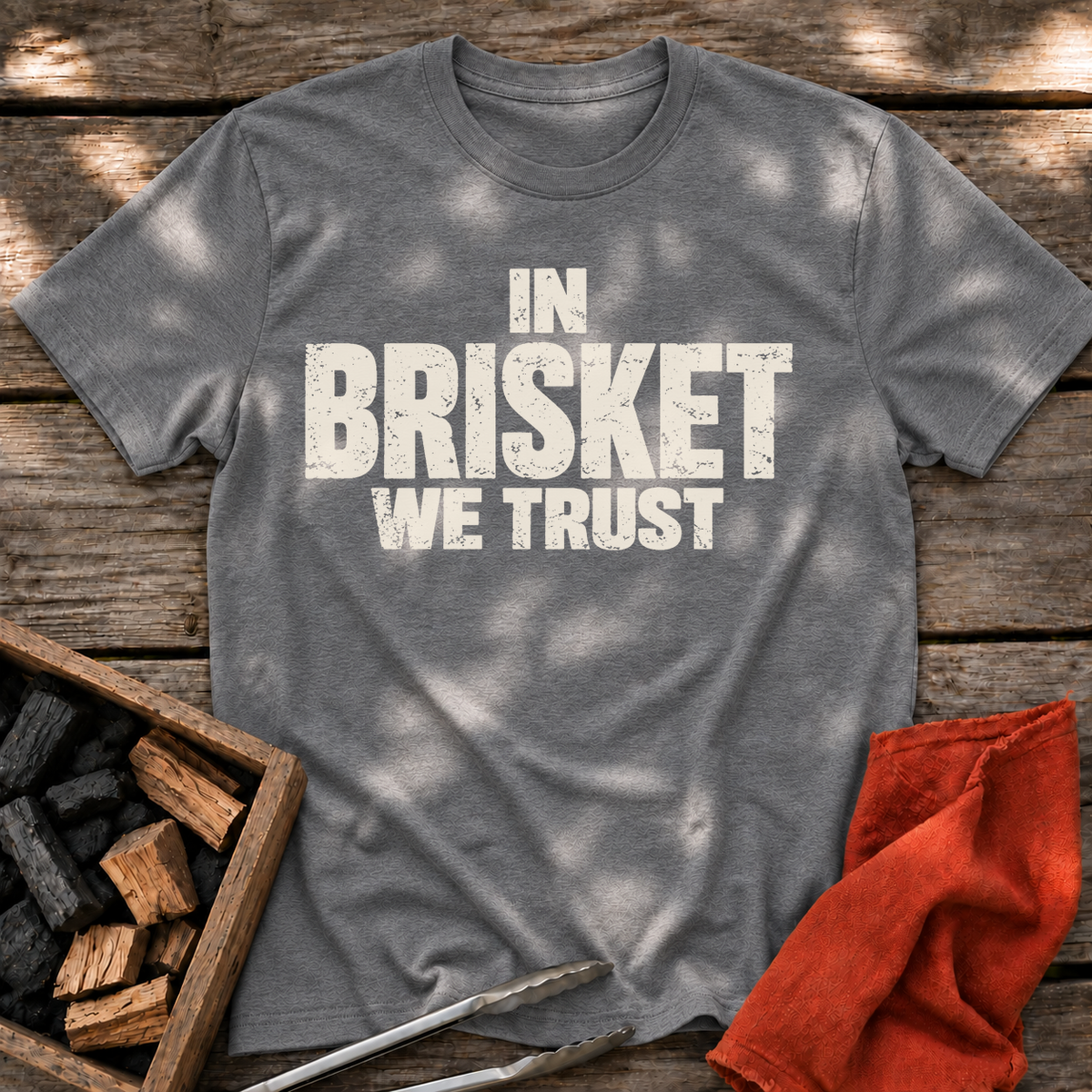 Graphite Heather T-shirt with the design “In Brisket We Trust.” printed on the front.