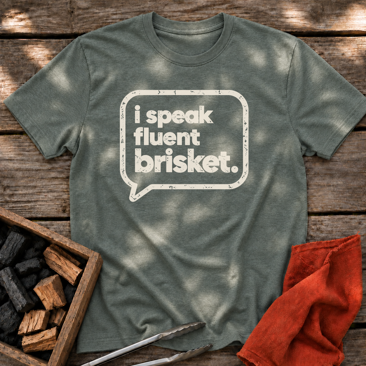 Heather Military Green T-shirt with the design “I Speak Fluent Brisket” printed on the front.