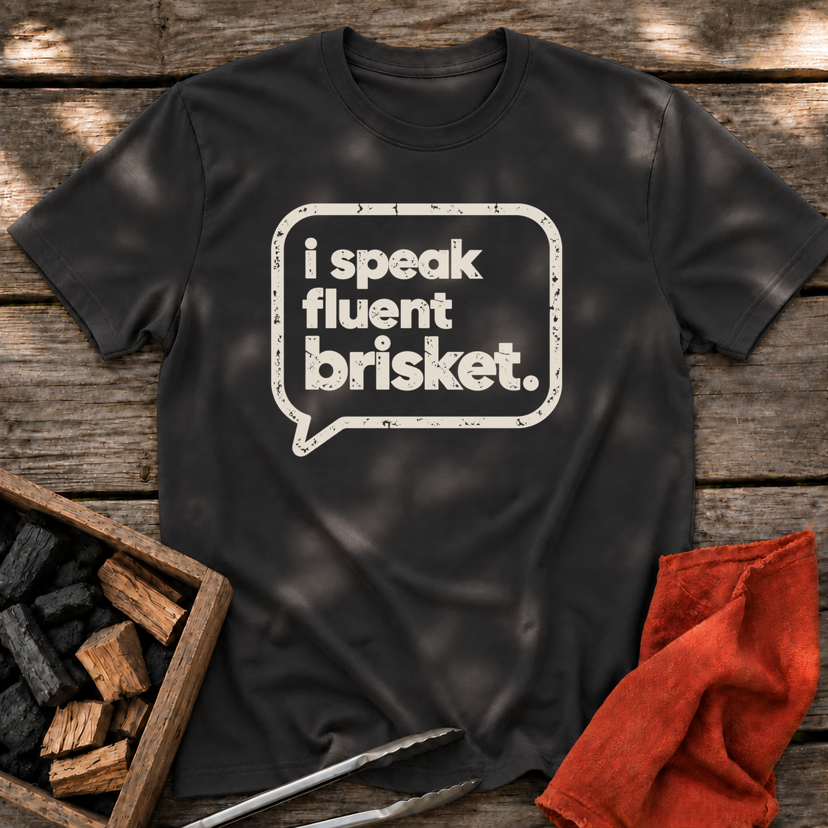 Black T-shirt with the design “I Speak Fluent Brisket” printed on the front.