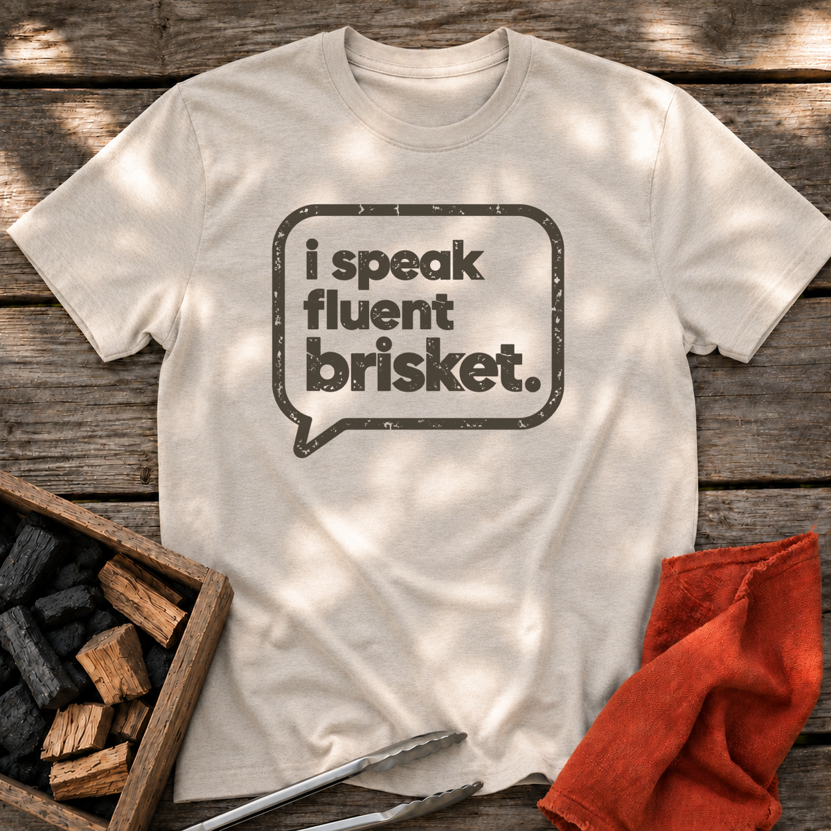Natural T-shirt with the design “I Speak Fluent Brisket” printed on the front.