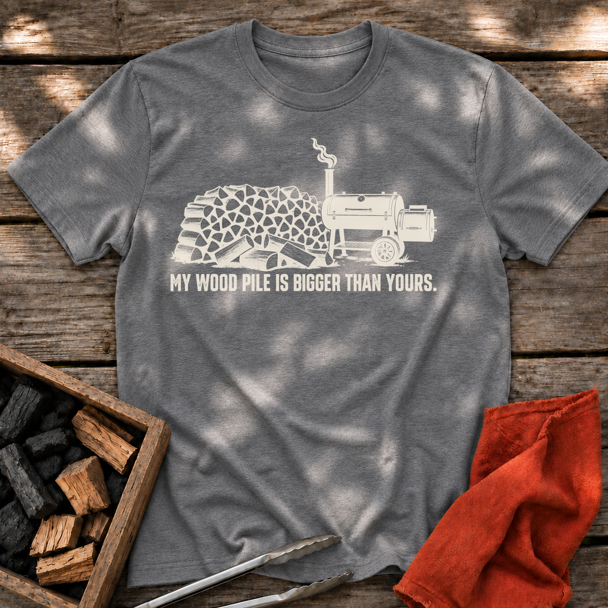 Graphite Heather T-shirt with the design “My Wood Pile is Bigger Than Yours” printed on the front.