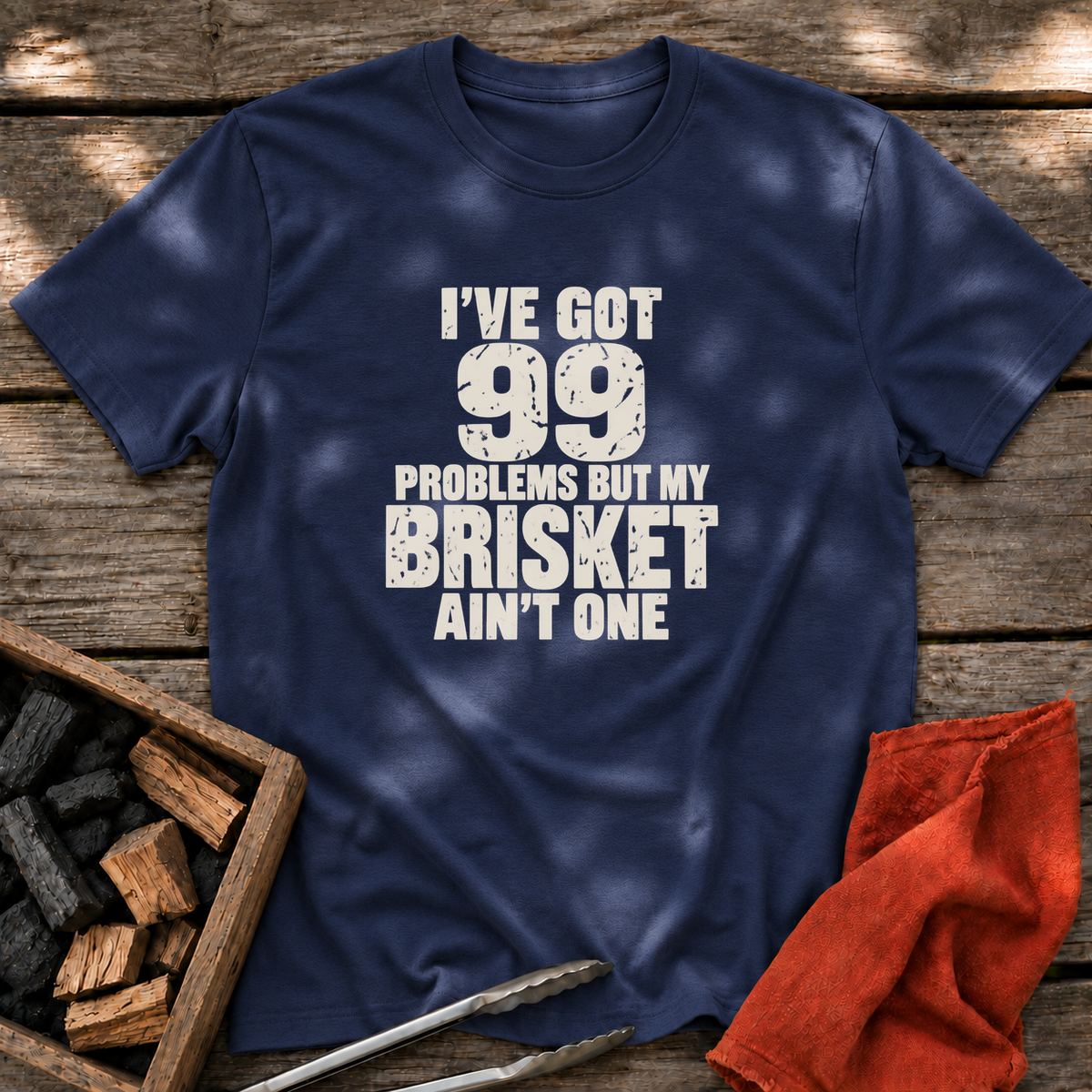 Navy T-shirt with the design “I've Got 99 Problems But My Brisket Ain't One” printed on the front.