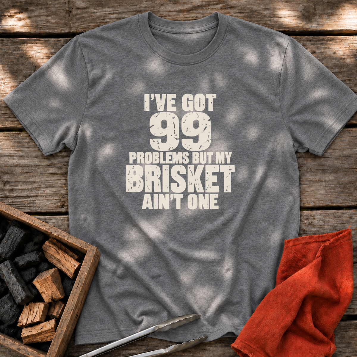 Graphite Heather T-shirt with the design “I've Got 99 Problems But My Brisket Ain't One” printed on the front.