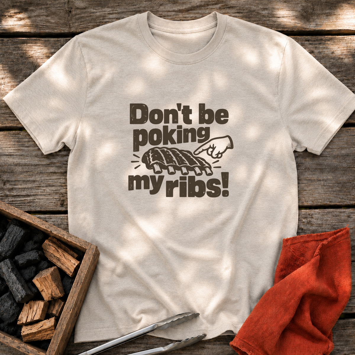 Natural T-shirt with the design “Don't be poking my ribs!” printed on the front.