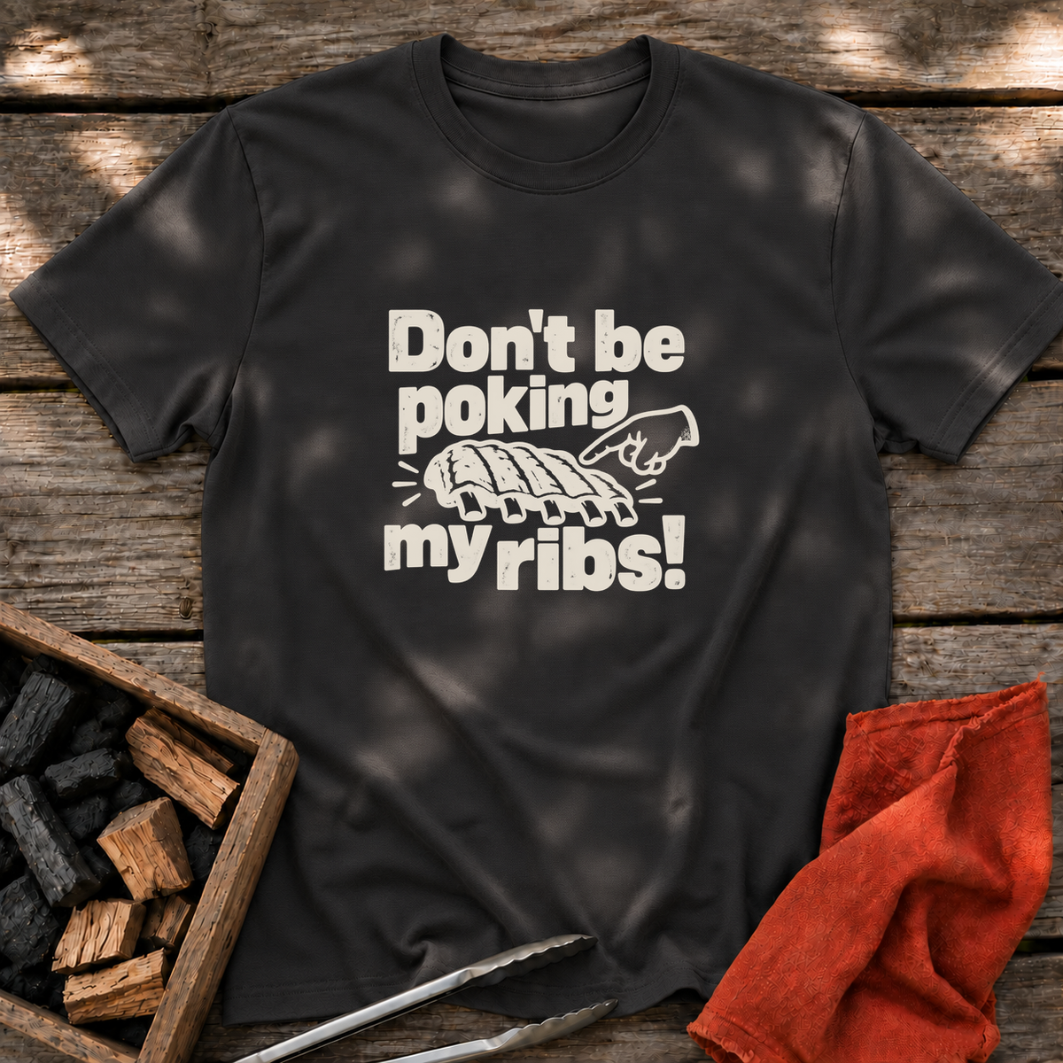 Black T-shirt with the design “Don't be poking my ribs!” printed on the front.
