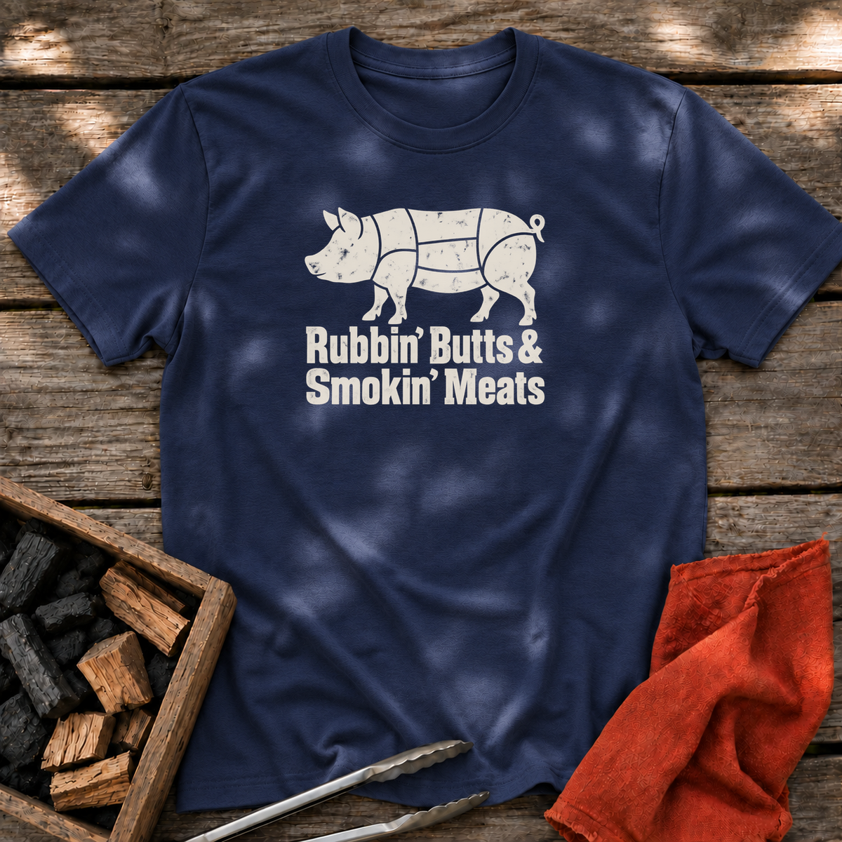 Navy T-shirt with the design “Rubbin' Butts & Smokin' Meats” printed on the front.