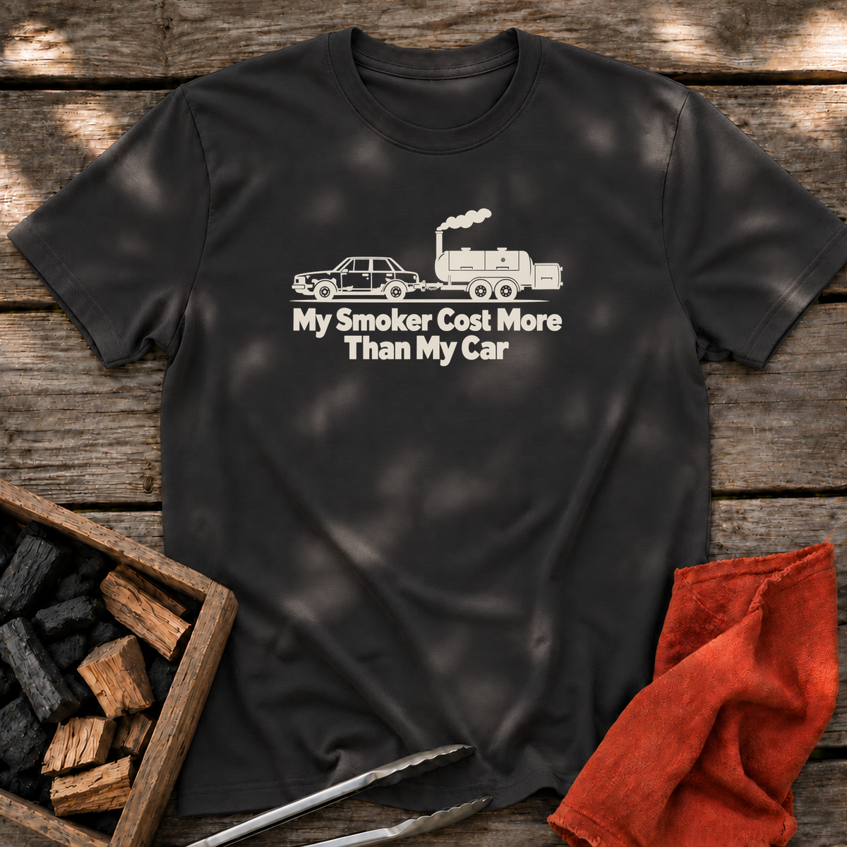Black T-shirt with the design “My Smoker Cost More Than My Car” printed on the front.