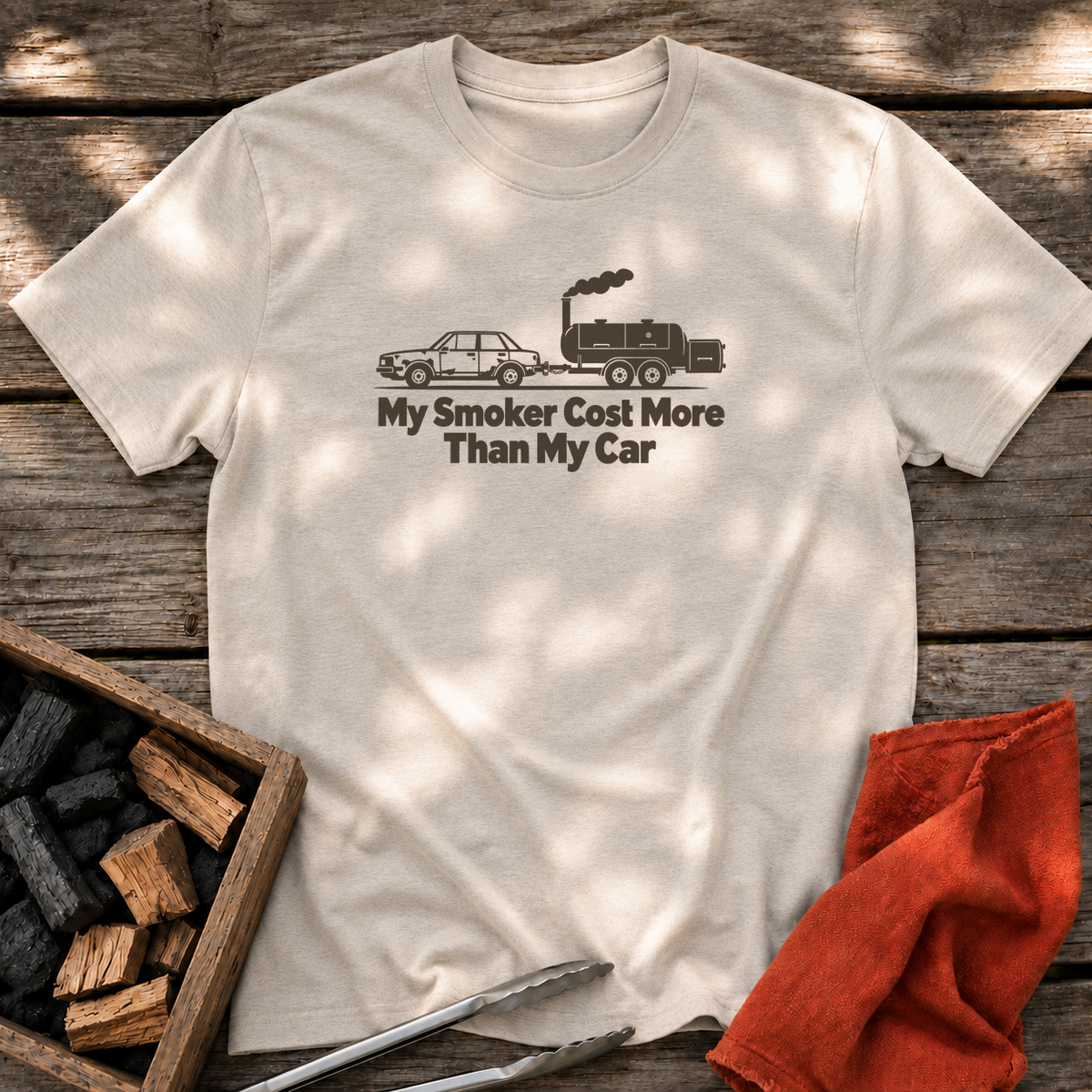 Natural T-shirt with the design “My Smoker Cost More Than My Car” printed on the front.