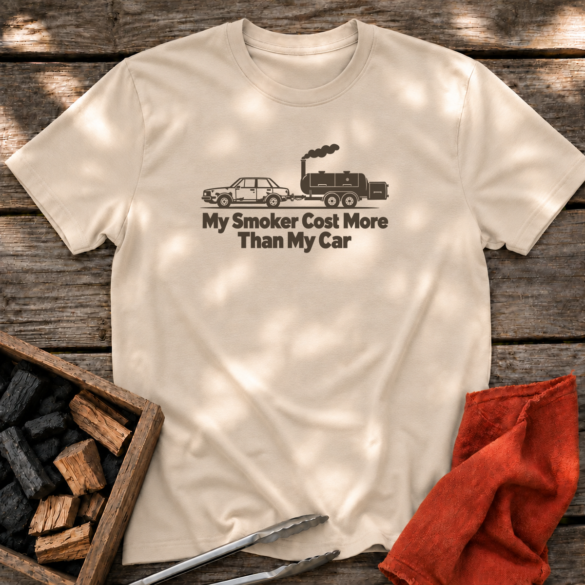 Sand T-shirt with the design “My Smoker Cost More Than My Car” printed on the front.