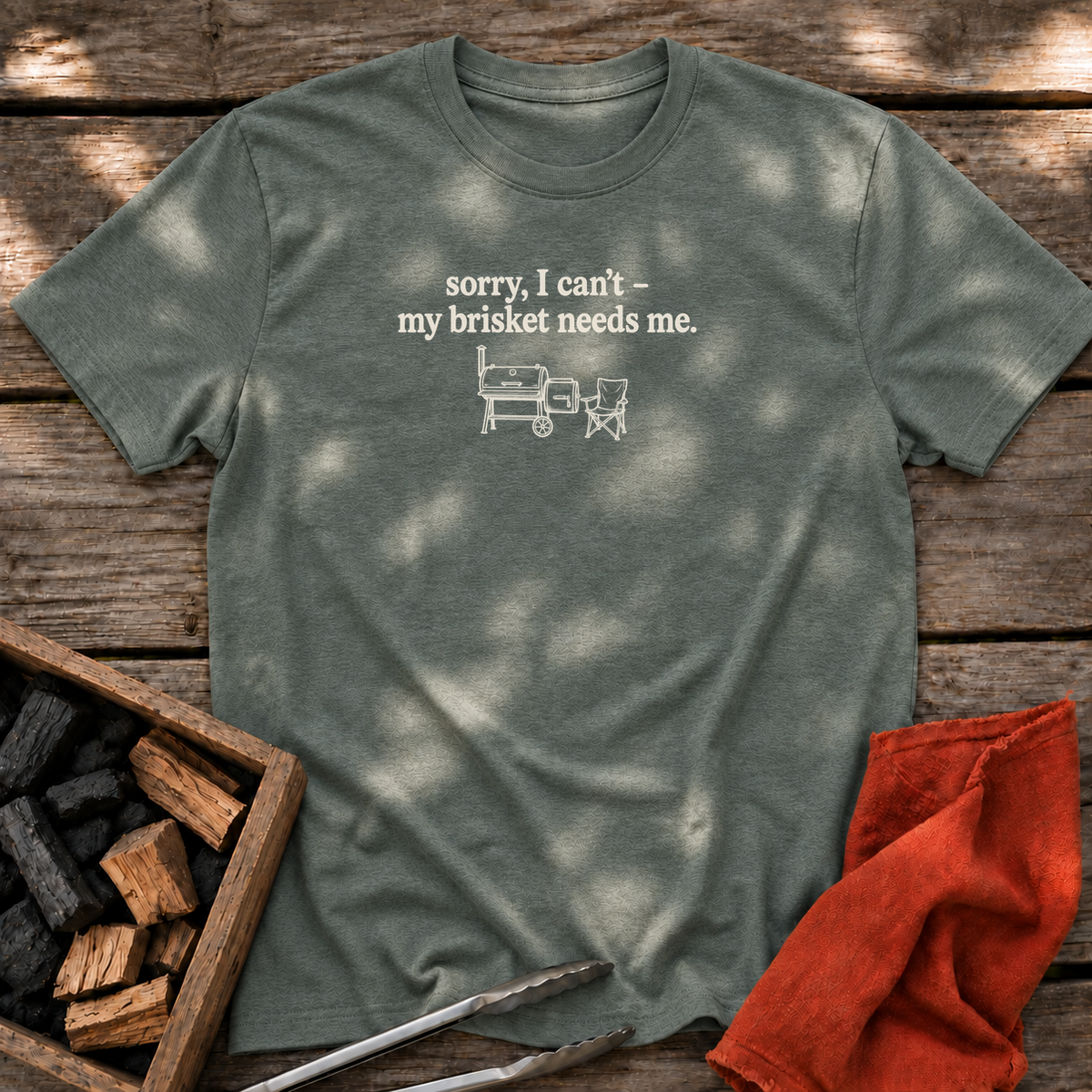 Heather Military Green T-shirt with the design “sorry, I can't - my brisket needs me.” printed on the front.