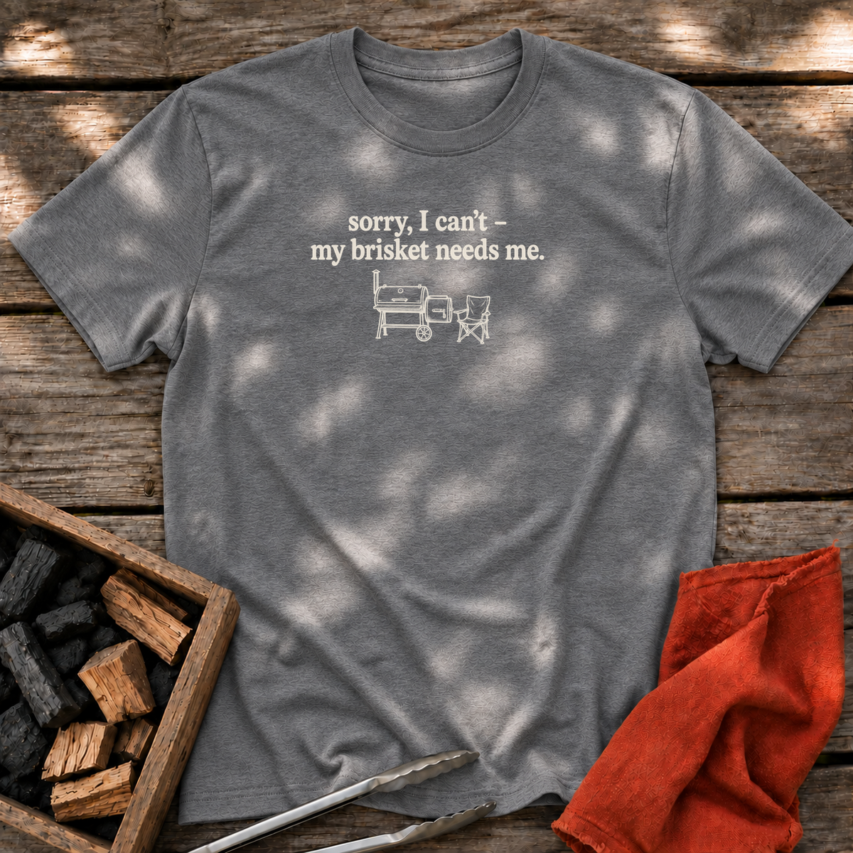 Graphite Heather T-shirt with the design “sorry, I can't - my brisket needs me.” printed on the front.