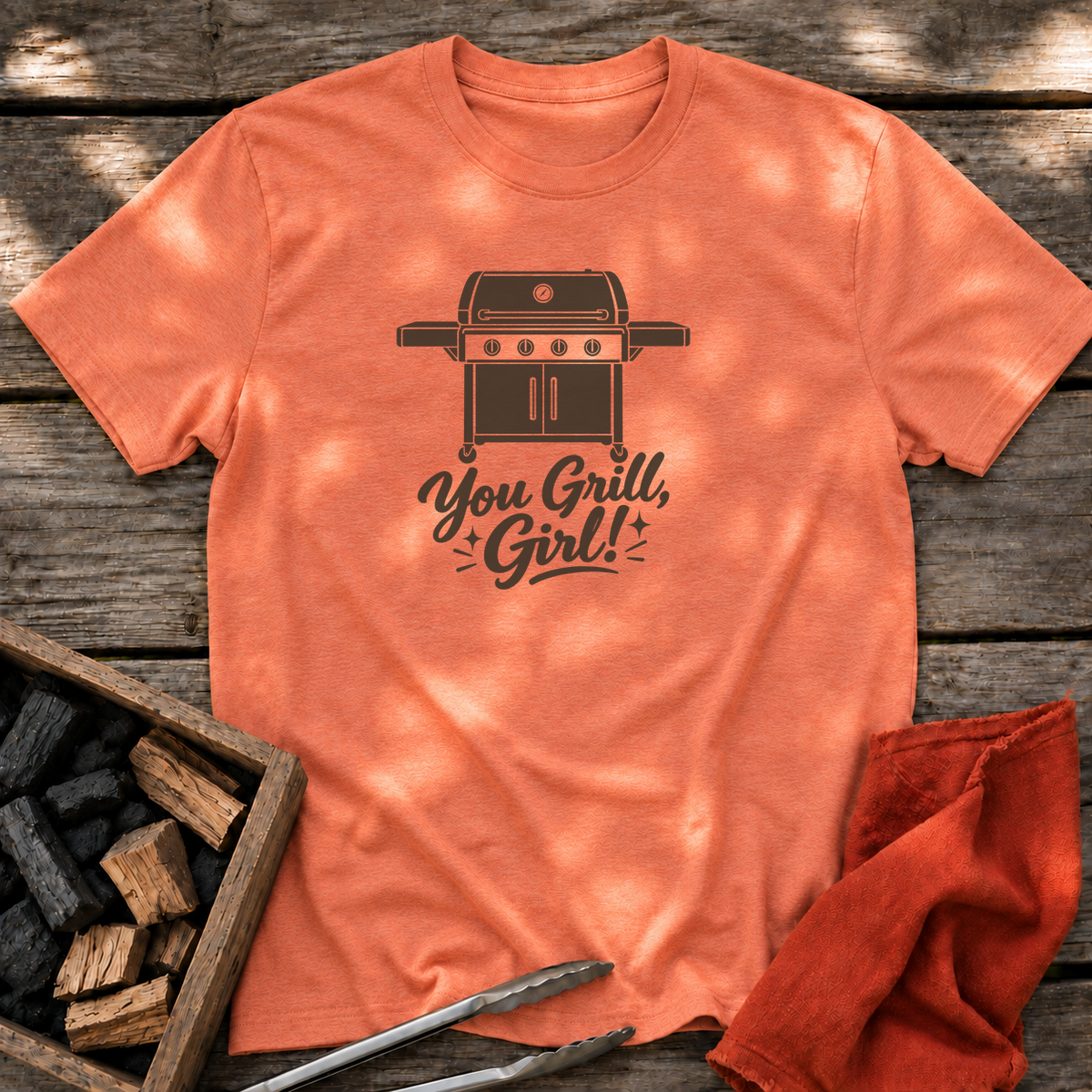Heather Orange T-shirt with the design “You Grill, Girl!” printed on the front.