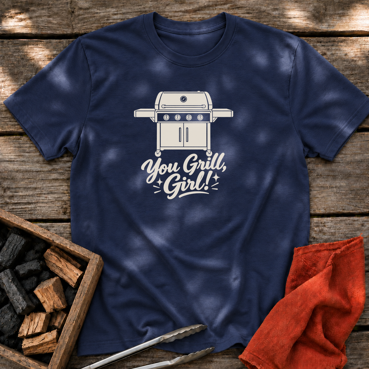 Navy T-shirt with the design “You Grill, Girl!” printed on the front.