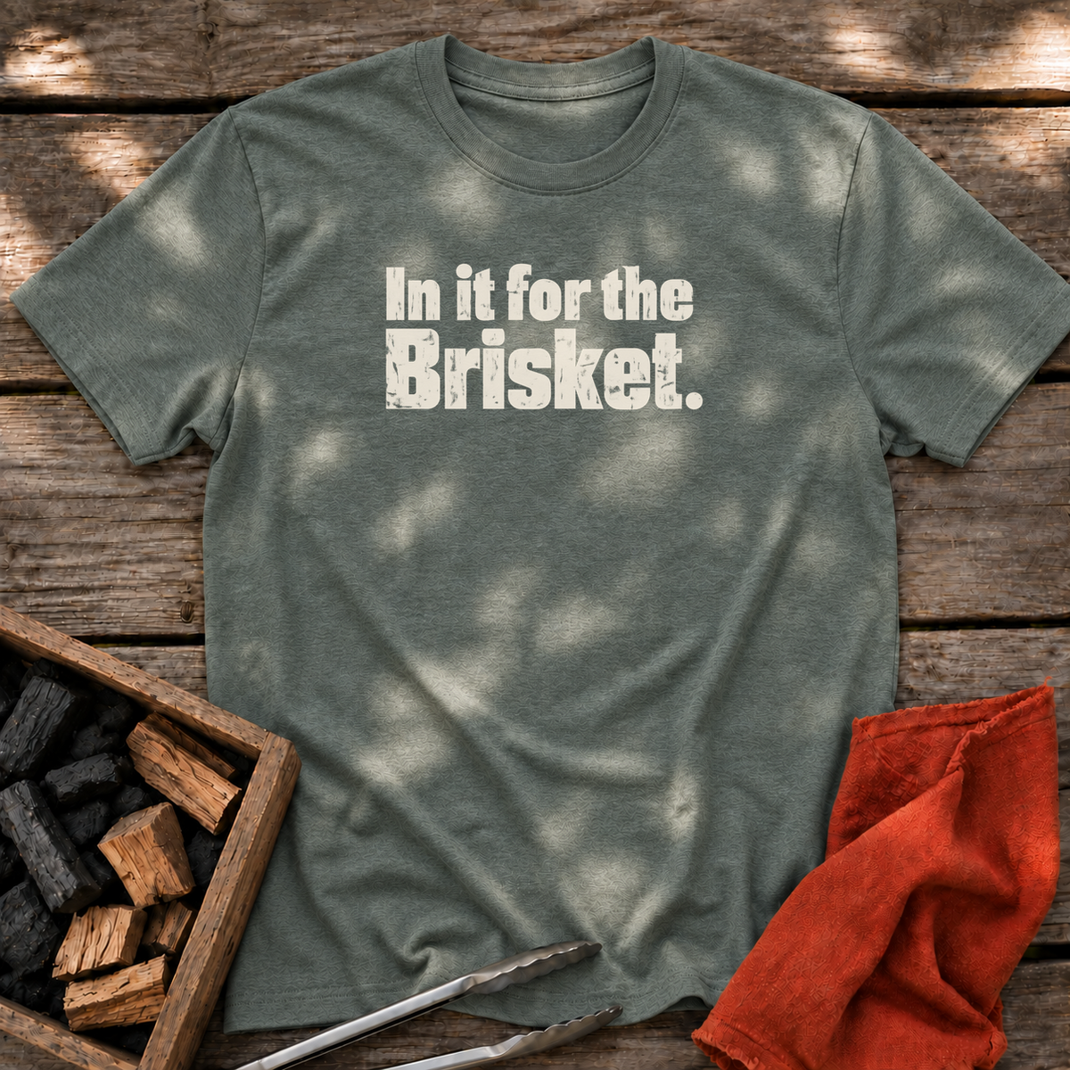 Heather Military Green T-shirt with the design “In it for the Brisket.” printed on the front.