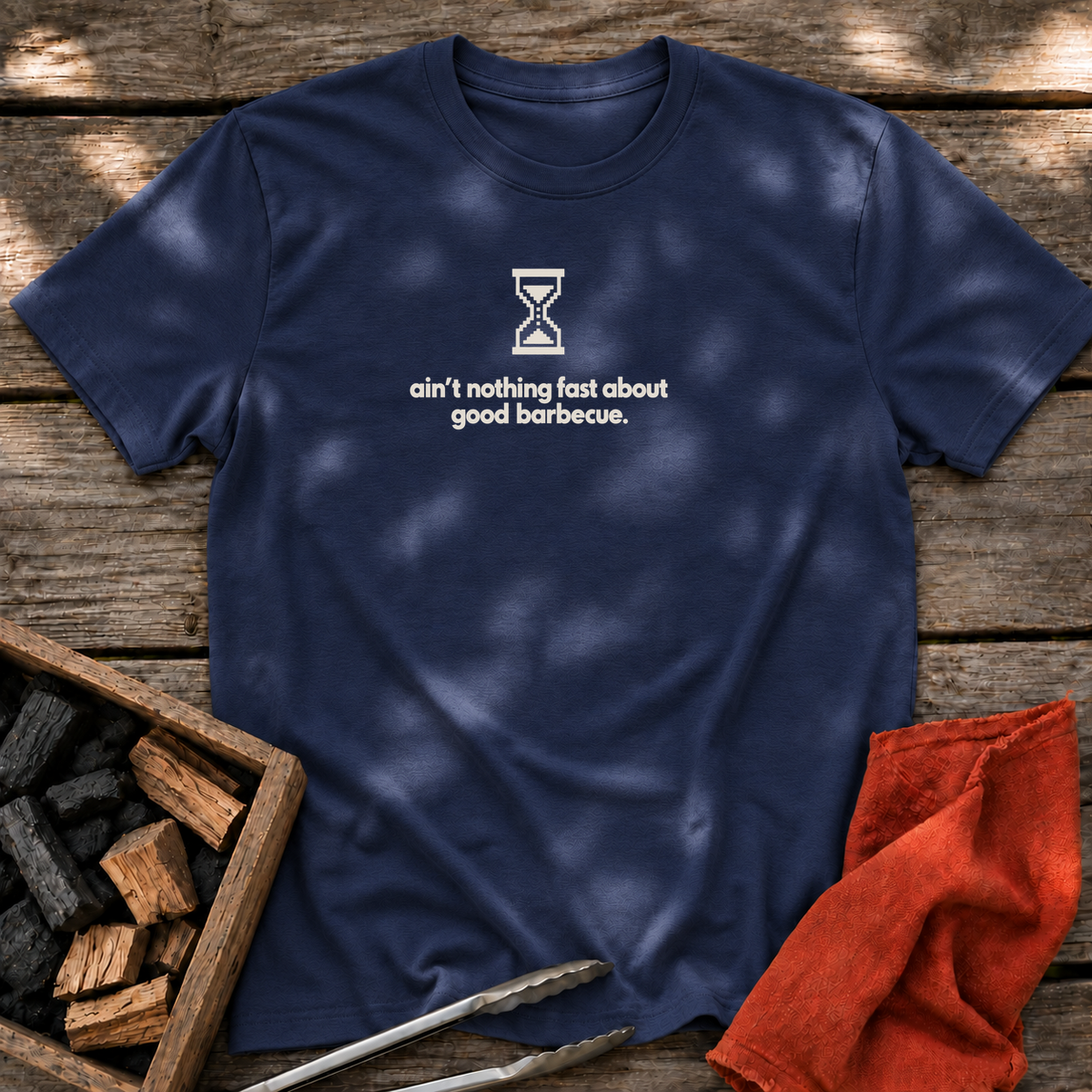 Navy T-shirt with the design “ain't nothing fast about good barbecue.” printed on the front.
