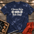 Navy T-shirt with the design “I Never Skip Rib Day” printed on the front.