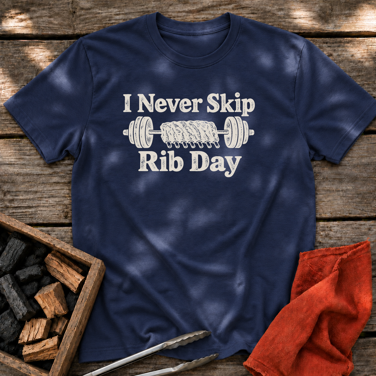 Navy T-shirt with the design “I Never Skip Rib Day” printed on the front.