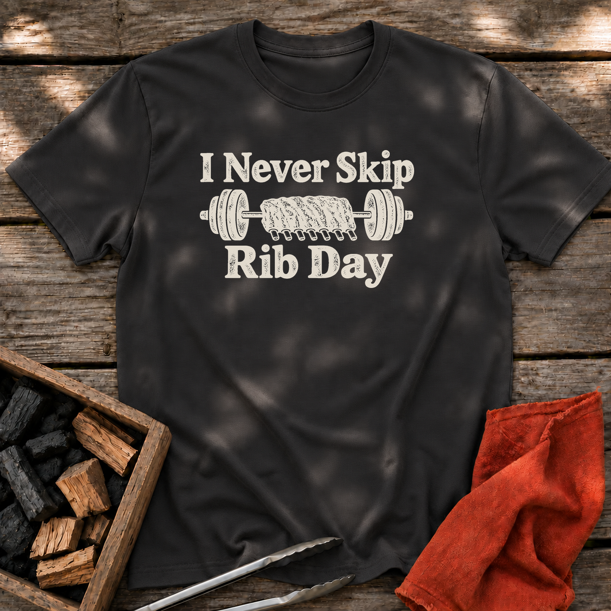 Black T-shirt with the design “I Never Skip Rib Day” printed on the front.