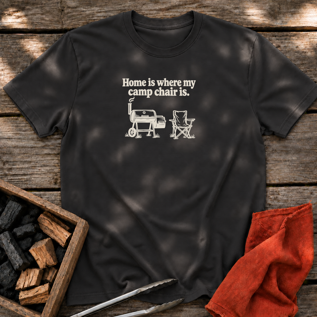 Black T-shirt with the design “Home is where my camp chair is.” printed on the front.