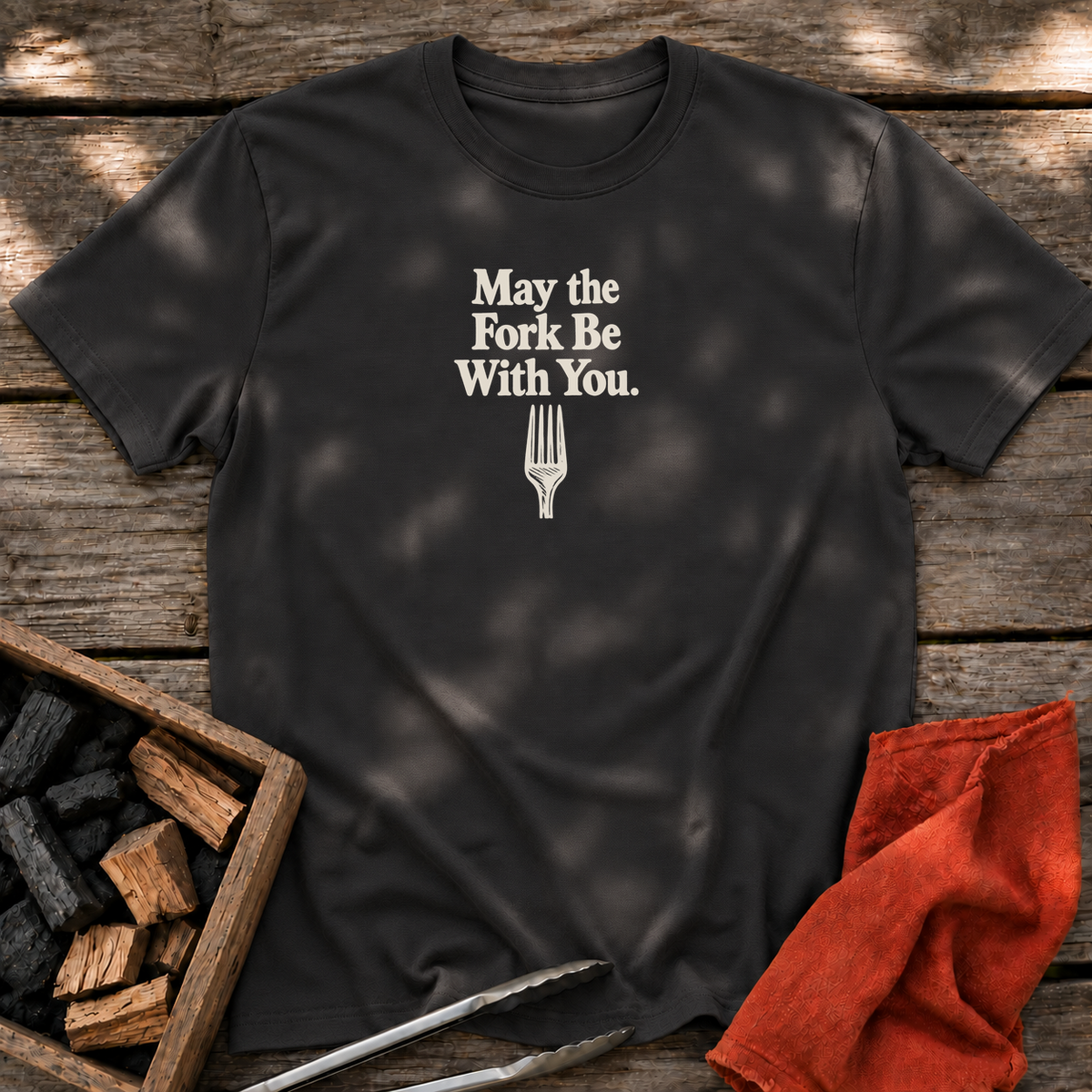 Black T-shirt with the design “May the Fork Be With You.” printed on the front.