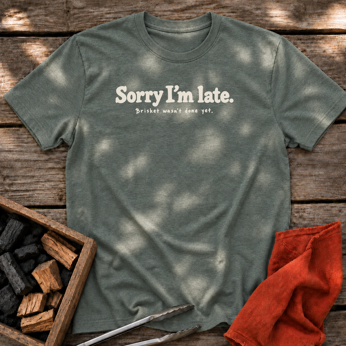 Heather Military Green T-shirt with the design “Sorry I’m late. Brisket wasn't done yet.” printed on the front.