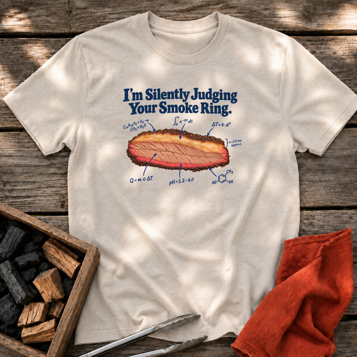 Natural T-shirt with the design “I’m Silently Judging Your Smoke Ring.” printed on the front.