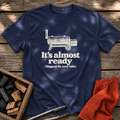 Navy T-shirt with the design “It's almost ready (Biggest lie ever told.)” printed on the front.