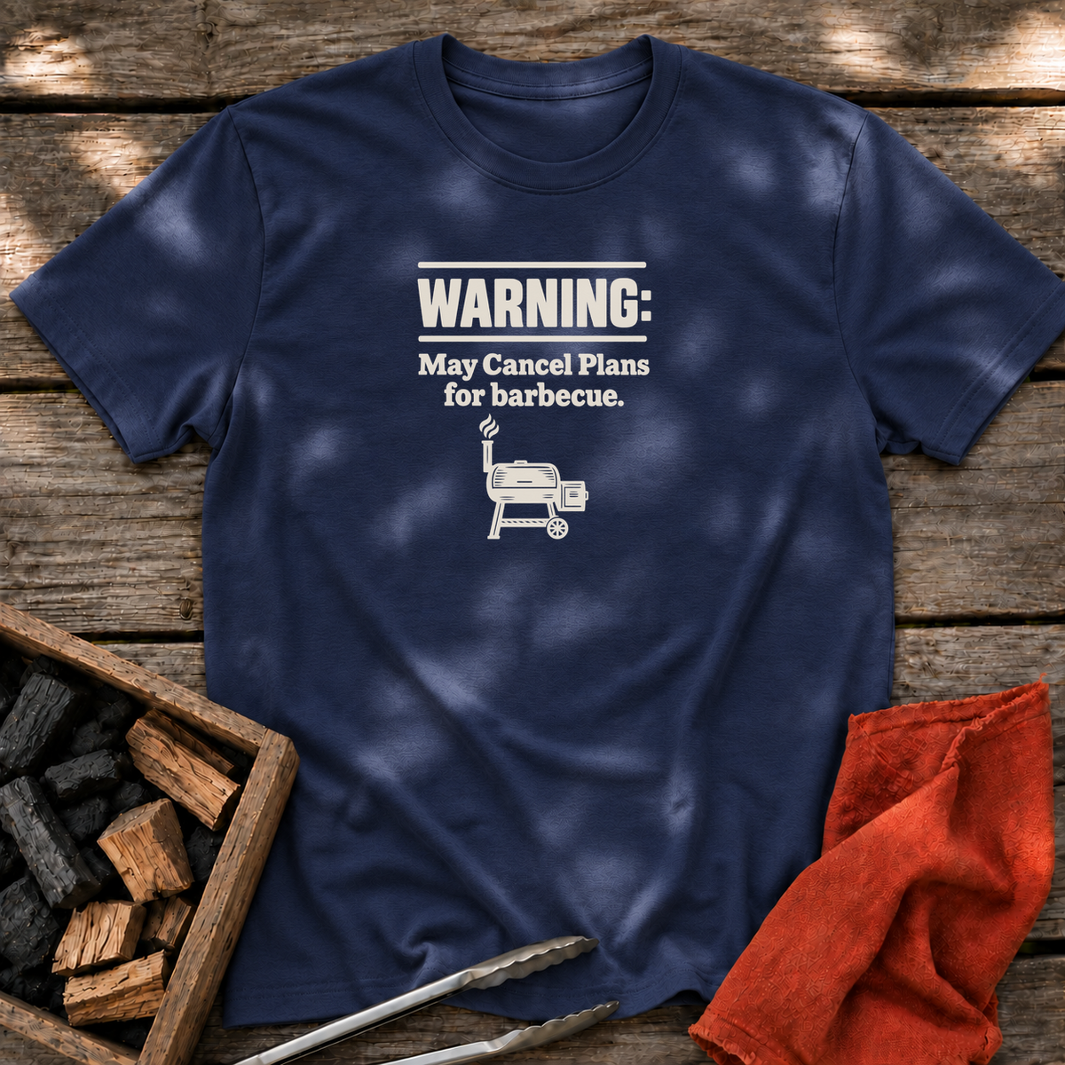 Navy T-shirt with the design “Warning: May Cancel Plans for barbecue.” printed on the front.