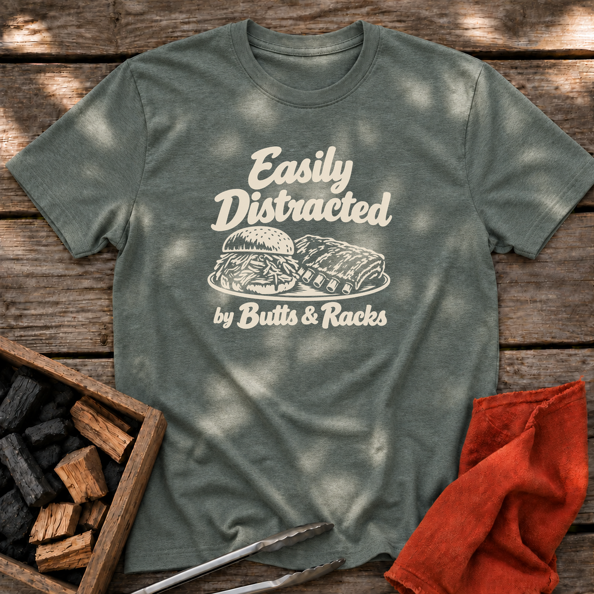 Heather Military Green T-shirt with the design “Easily Distracted by Butts & Racks” printed on the front.
