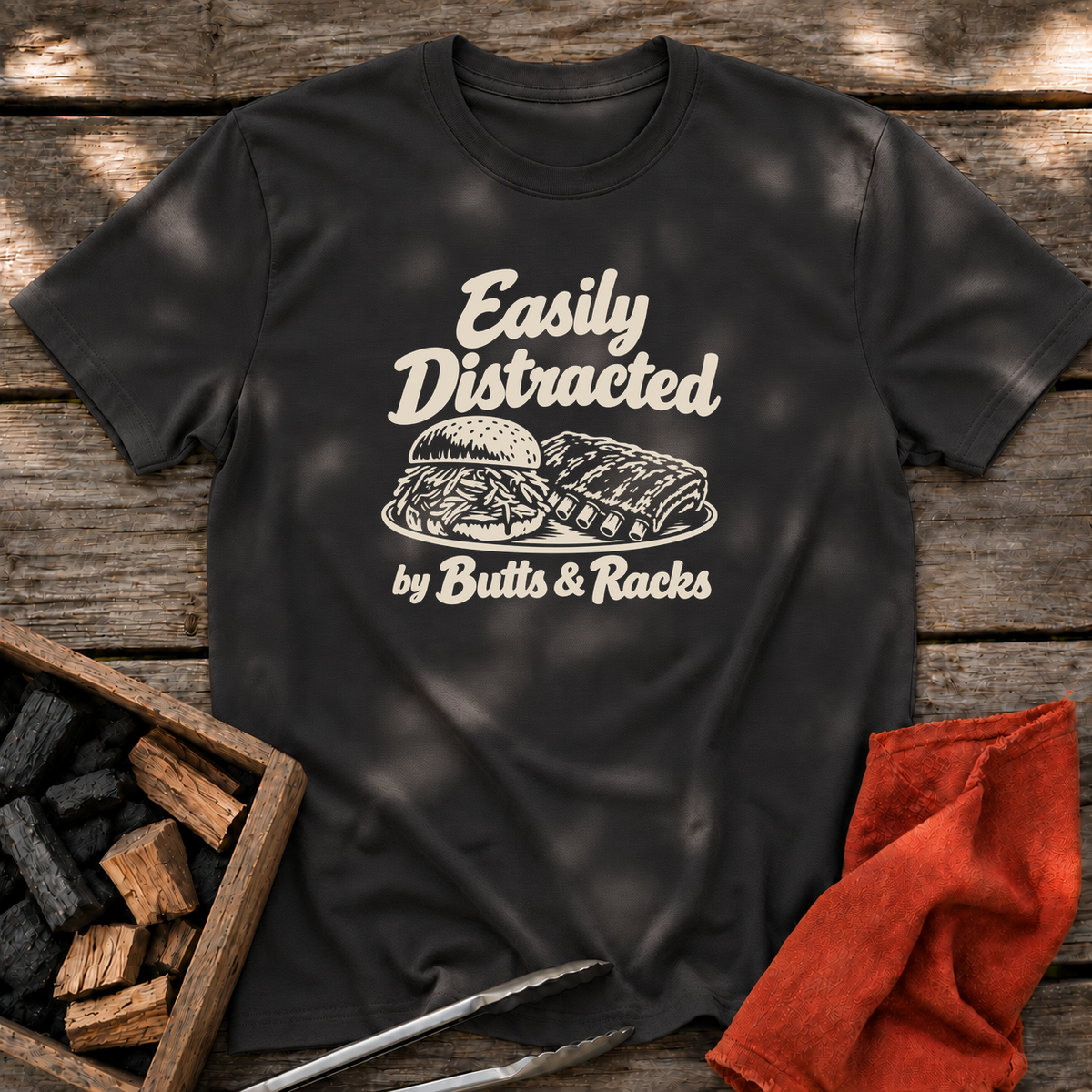 Black T-shirt with the design “Easily Distracted by Butts & Racks” printed on the front.