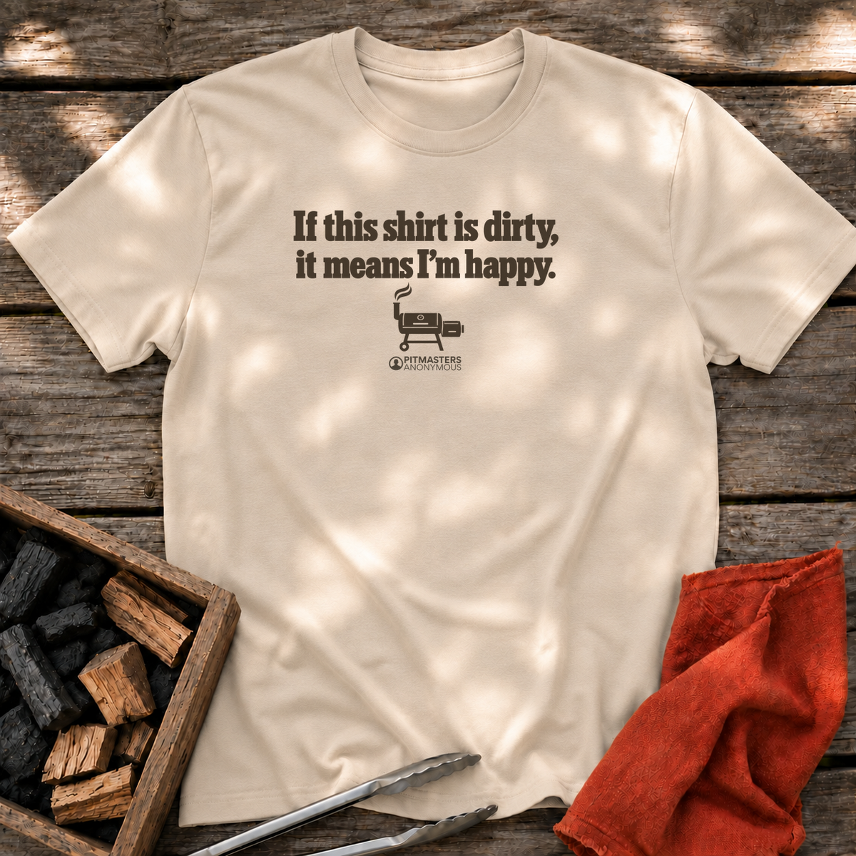 Sand T-shirt with the design “If this shirt is dirty, it means I’m happy.” printed on the front.