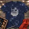 Navy T-shirt with the design “SOMEWHERE BETWEEN WRAPPED AND WORRIED” printed on the front.