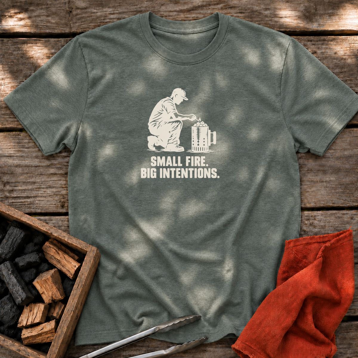 Heather Military Green T-shirt with the design “SMALL FIRE. BIG INTENTIONS.” printed on the front.