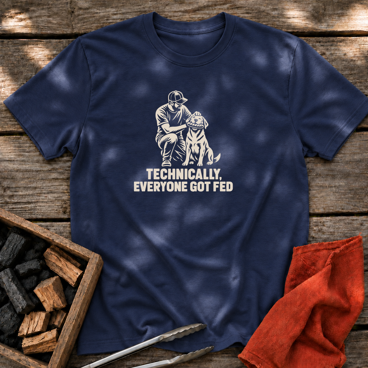Navy T-shirt with the design “TECHNICALLY, EVERYONE GOT FED” printed on the front.