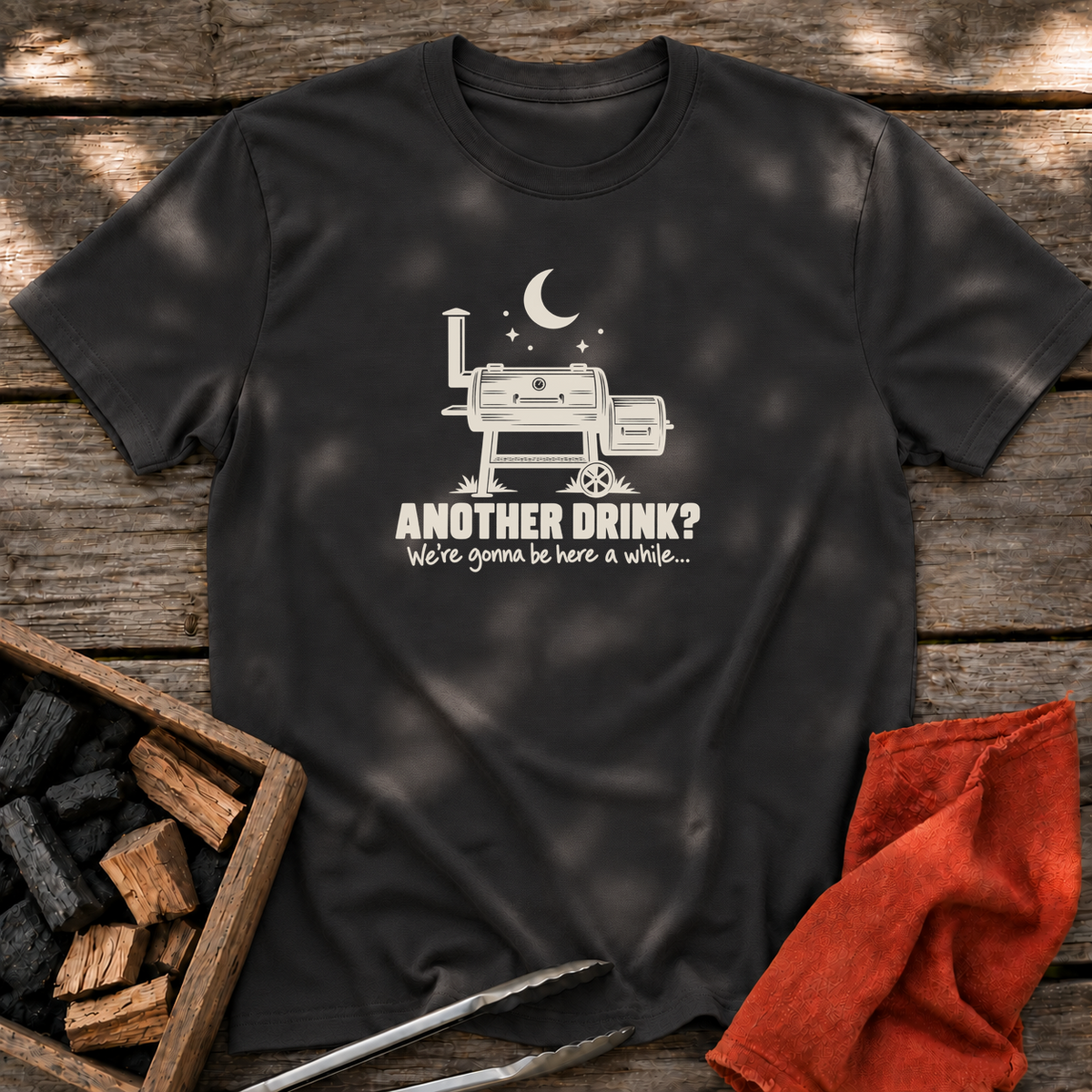 Black T-shirt with the design “Another drink? We're gonna be here a while...” printed on the front.