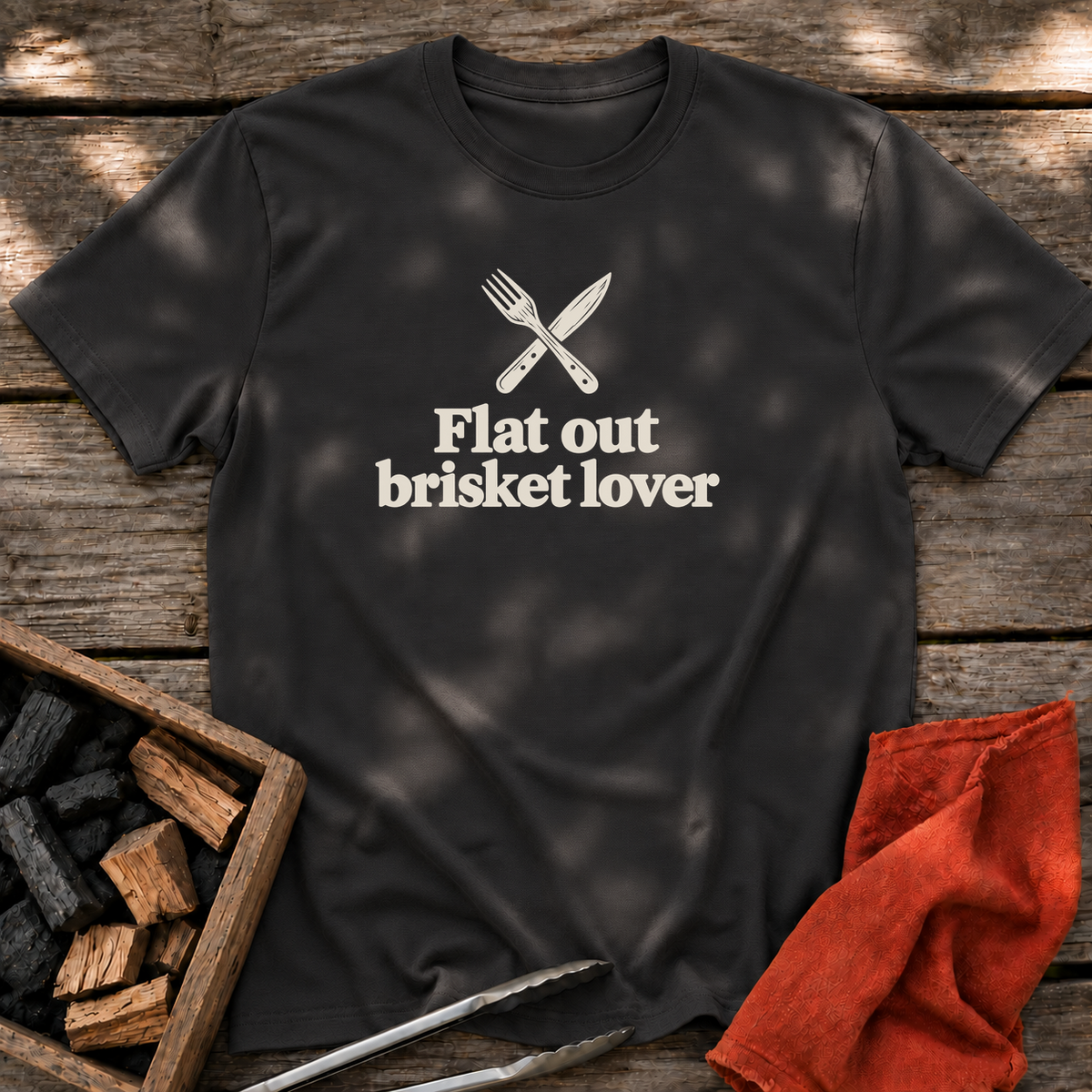 Black T-shirt with the design “Flat out brisket lover” printed on the front.